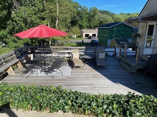 599 Union Street Braintree, MA 02184 - Photo 2 of 17 a patio with tables and chairs with a barbeque grill