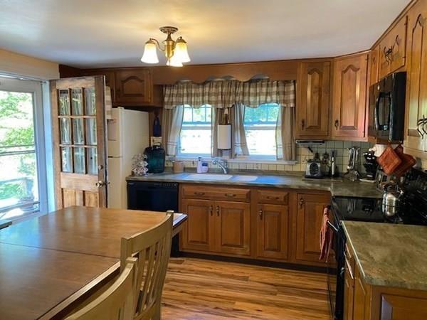 599 Union Street Braintree, MA 02184 - Photo 3 of 17 a kitchen with a stove a sink and a refrigerator