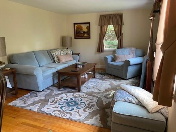 599 Union Street Braintree, MA 02184 - Photo 6 of 17 a living room with furniture and a large window