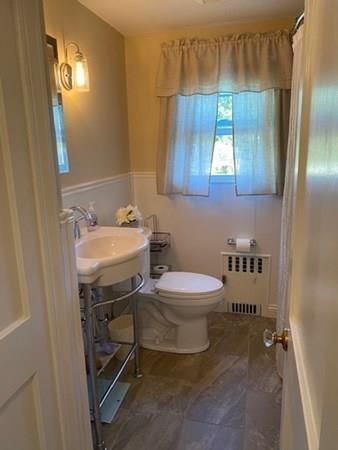 599 Union Street Braintree, MA 02184 - Photo 8 of 17 a bathroom with a sink toilet and mirror