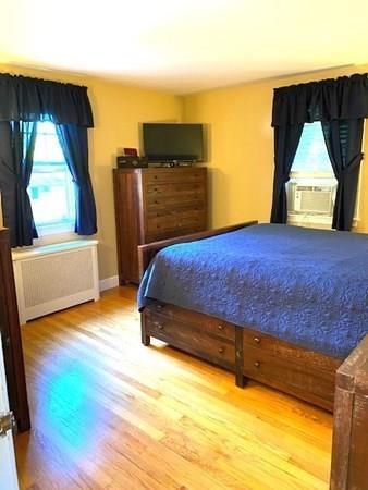 599 Union Street Braintree, MA 02184 - Photo 9 of 17 a bedroom with a bed and a window