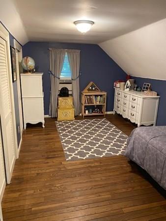 599 Union Street Braintree, MA 02184 - Photo 10 of 17 a spacious bedroom with a bed and a dresser