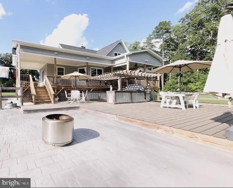 26293 Old Pitts Road Ruther Glen, VA 22546 - Photo 32 of 41 wood and concrete entertaining area from deck
