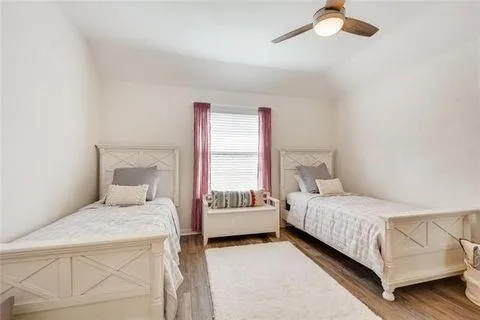 a bedroom with a bed and a table