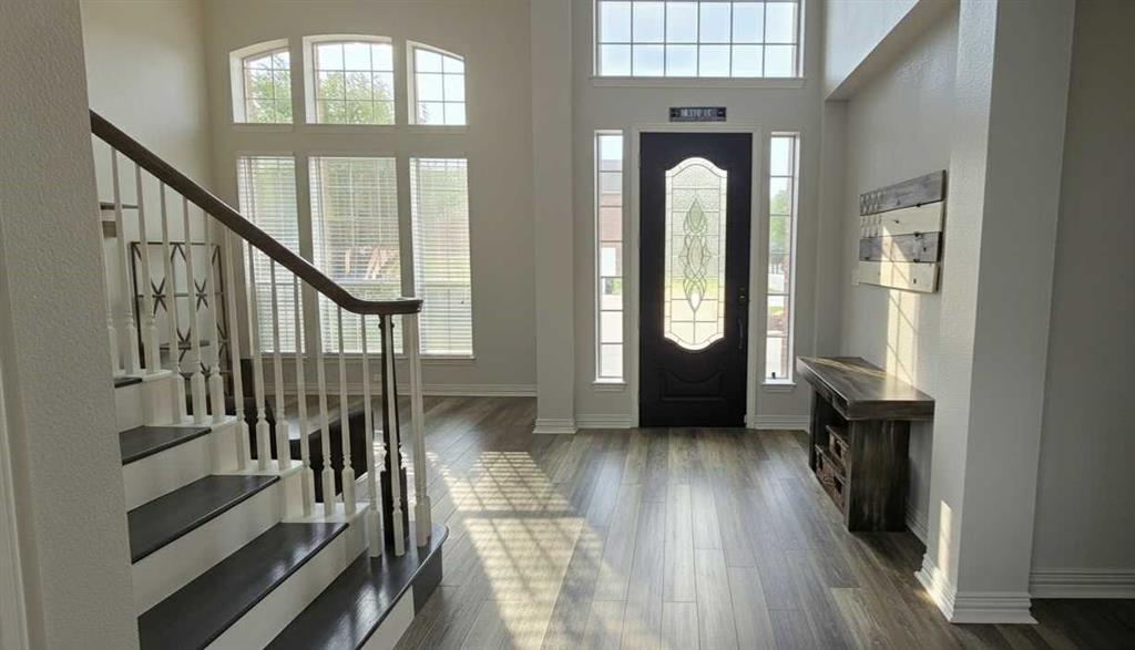 1715 Ranger Drive Keller, TX 76248 - Photo 2 of 20 a view of entryway and hall with wooden floor