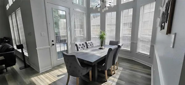 a view of a dining room with furniture and window