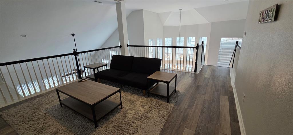 1715 Ranger Drive Keller, TX 76248 - Photo 7 of 20 a view of a hallway with wooden floor and furniture