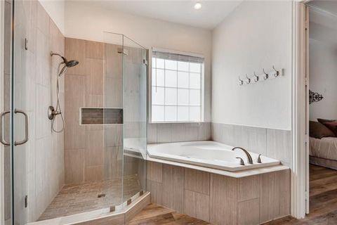 1715 Ranger Drive Keller, TX 76248 - Photo 9 of 20 a bathroom with a bathtub and shower