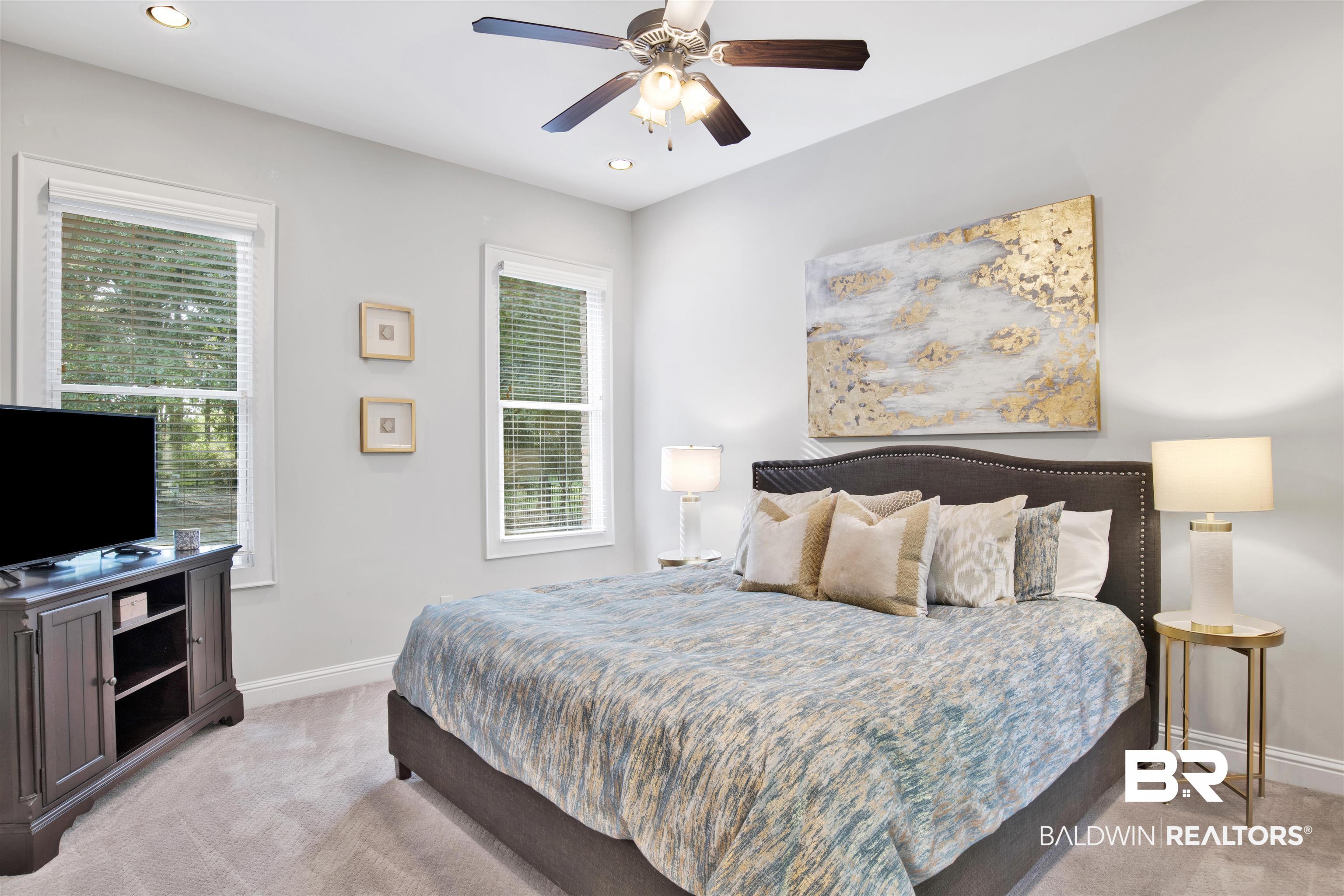 11244 Redfern Road Daphne, AL 36526 - Photo 38 of 50 Bedroom with light carpet, ceiling fan, and multiple windows