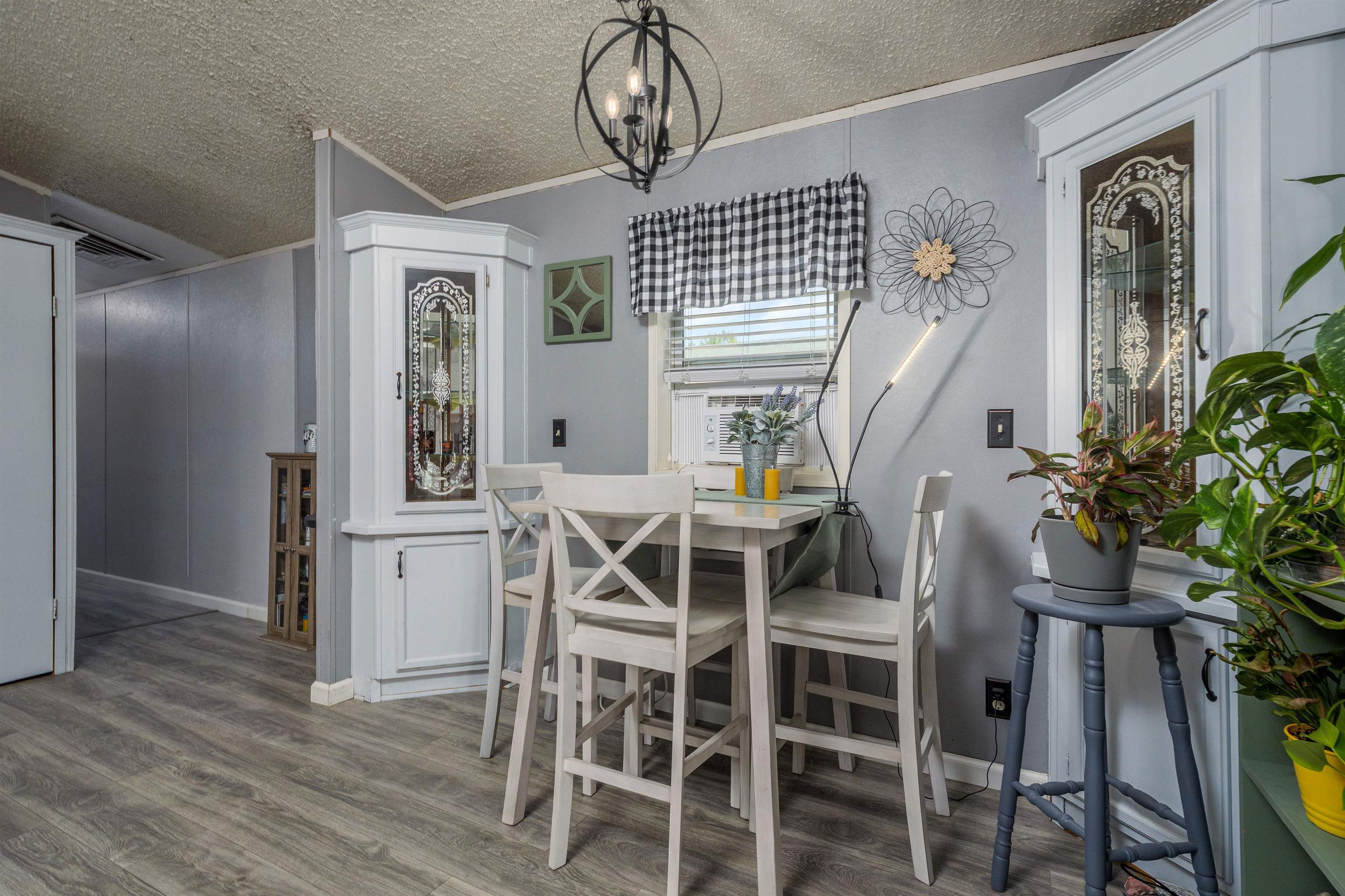 435 32 Road, Unit 705 Clifton, CO 81520 - Photo 14 of 25 a view of a dining room with furniture window and wooden floor