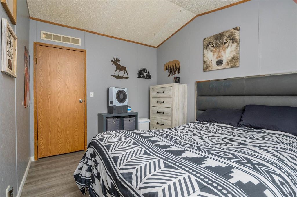 435 32 Road, Unit 705 Clifton, CO 81520 - Photo 16 of 25 a bedroom with a bed and a dresser