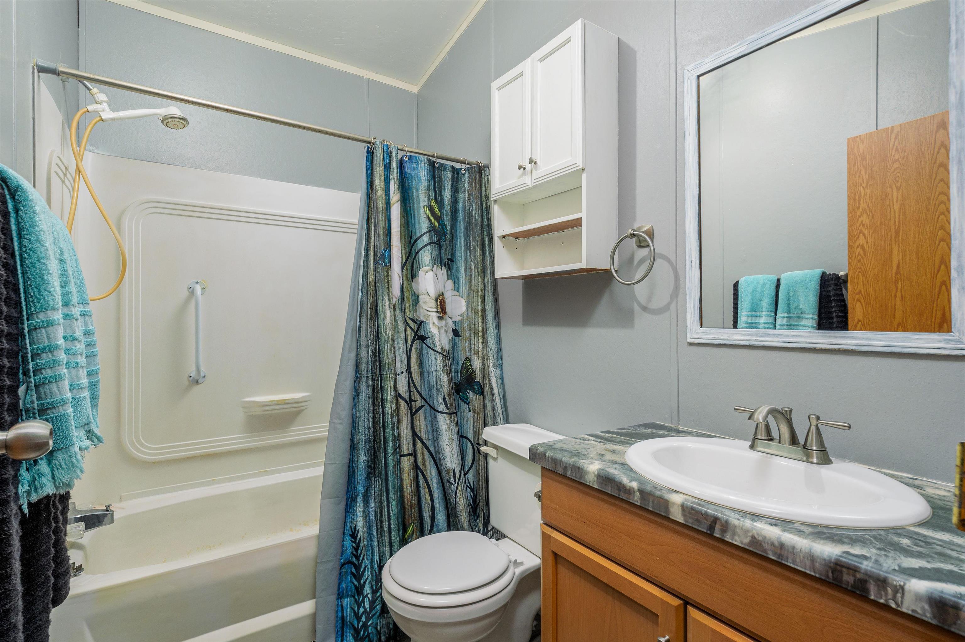 435 32 Road, Unit 705 Clifton, CO 81520 - Photo 18 of 25 a bathroom with a granite countertop sink toilet and shower