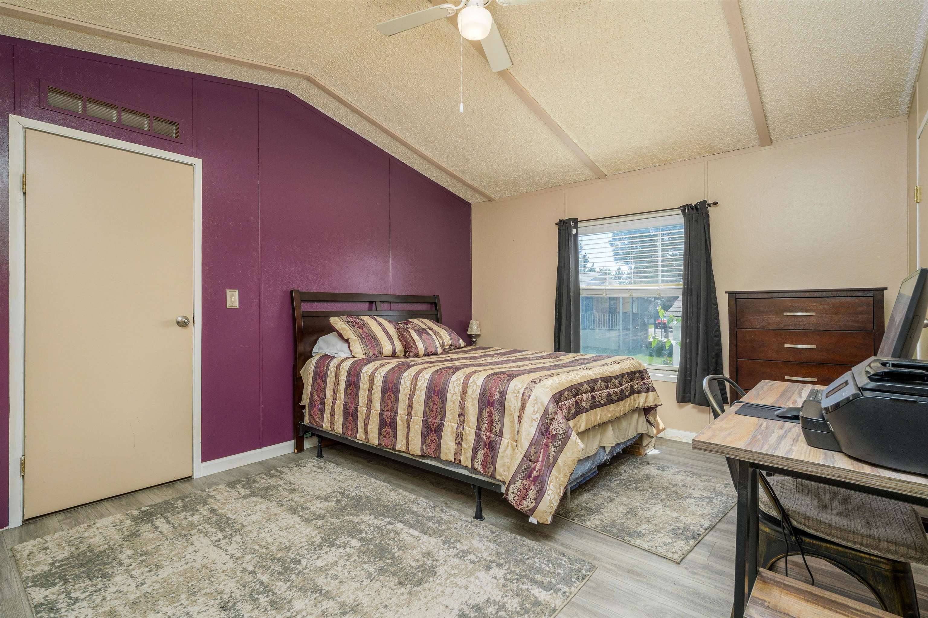 435 32 Road, Unit 705 Clifton, CO 81520 - Photo 20 of 25 a bed sitting in a bedroom next to a window