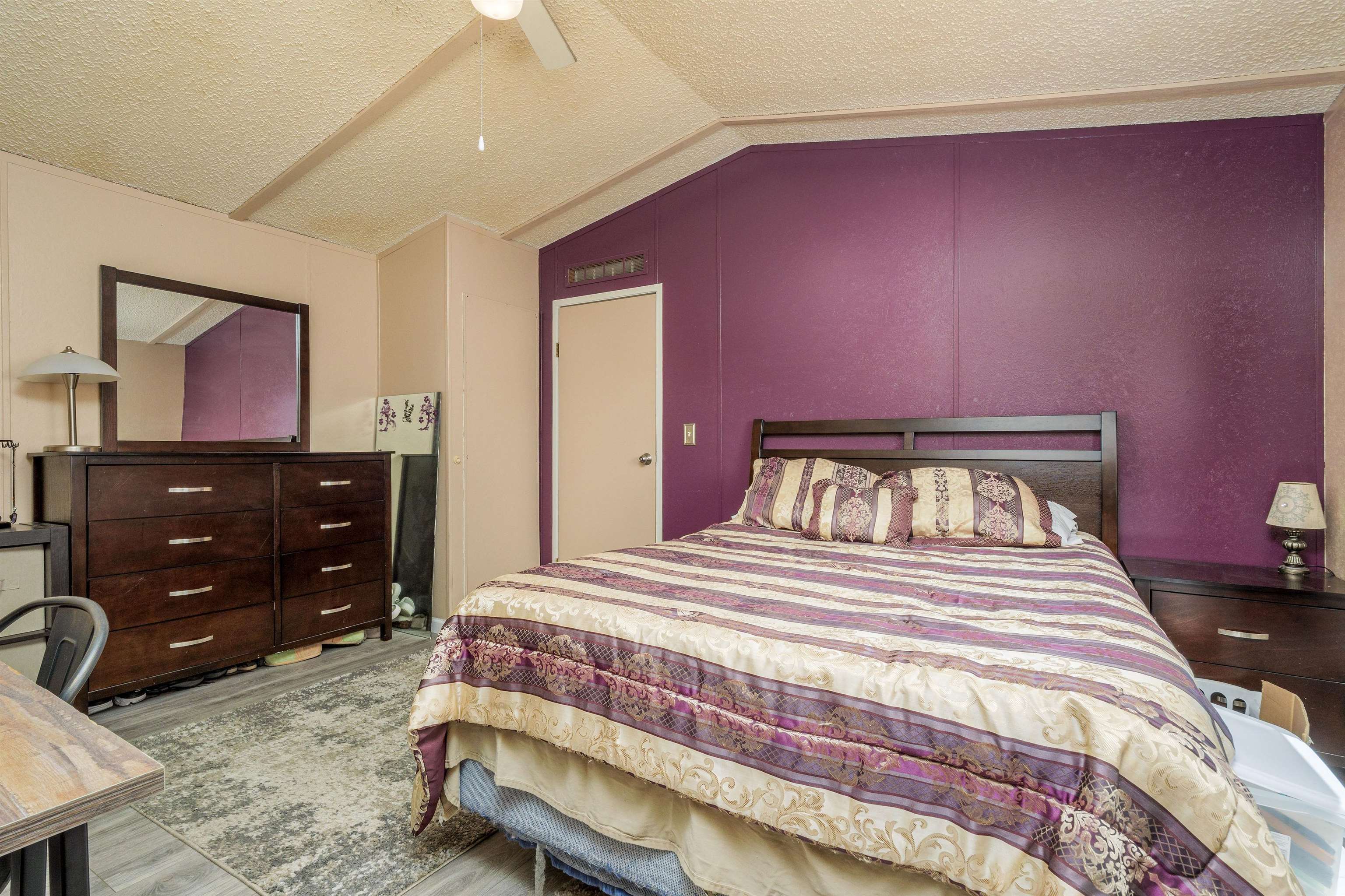 435 32 Road, Unit 705 Clifton, CO 81520 - Photo 21 of 25 a bedroom with a bed and a dresser