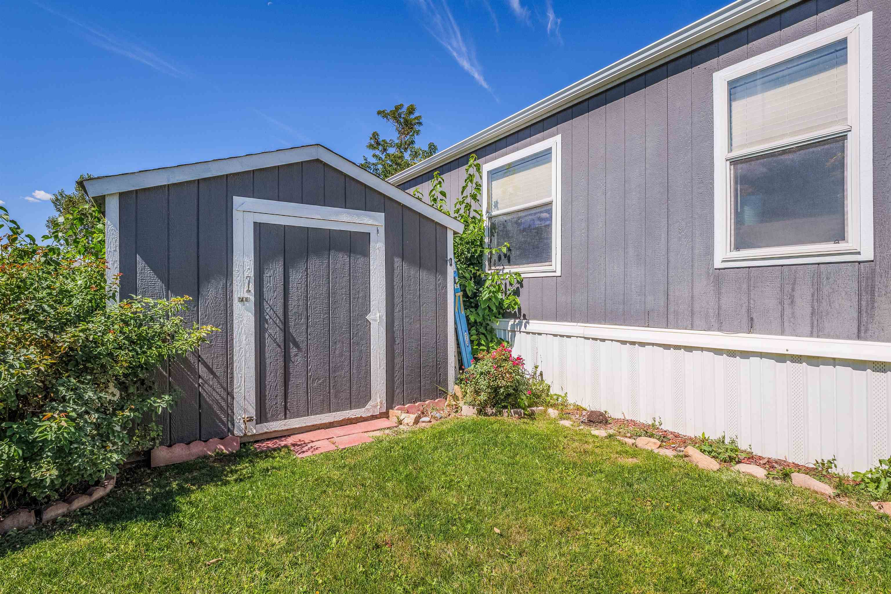 435 32 Road, Unit 705 Clifton, CO 81520 - Photo 23 of 25 a view front of house with backyard and garden