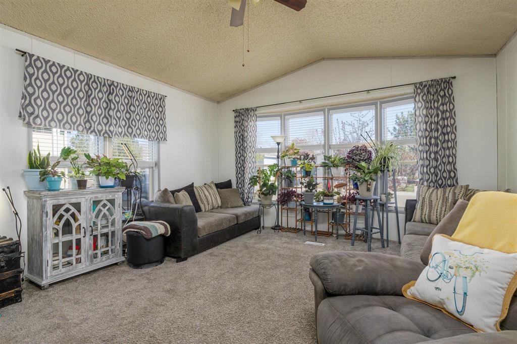 435 32 Road, Unit 705 Clifton, CO 81520 - Photo 8 of 25 a living room with furniture and a large window