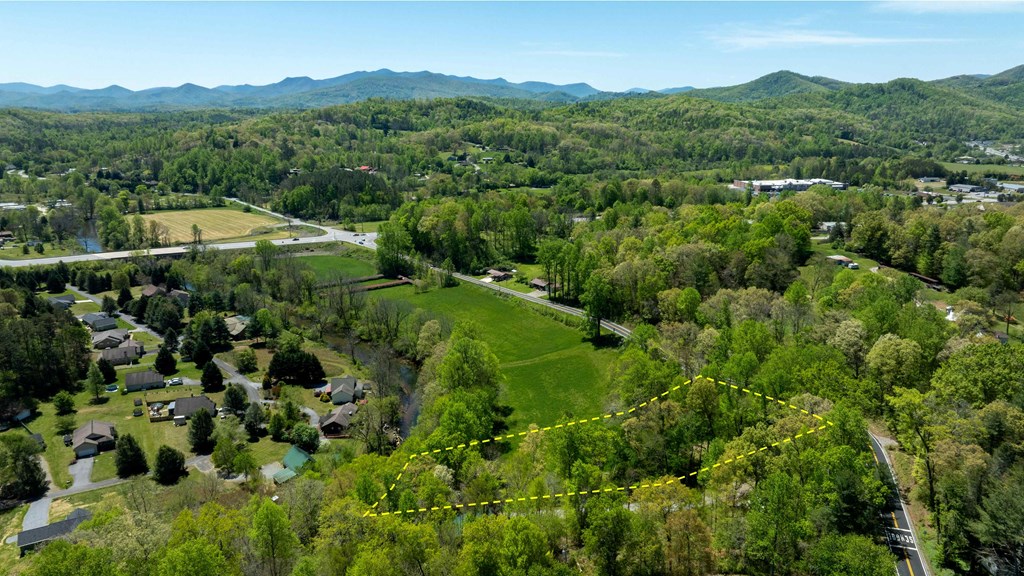 981 Myers Chapel Road Hayesville, NC 28904 - Photo 14 of 44 a view of a lush green hillside and houses
