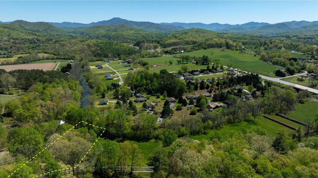 981 Myers Chapel Road Hayesville, NC 28904 - Photo 4 of 44 a view of a lush green hillside and houses