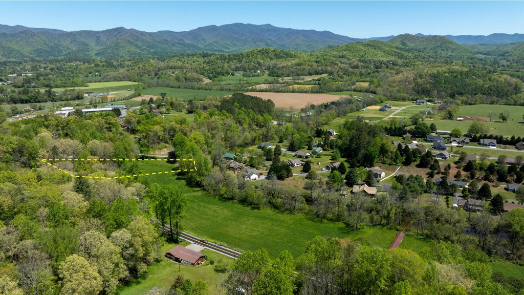 981 Myers Chapel Road Hayesville, NC 28904 - Photo 7 of 44 a view of a lush green hillside and houses