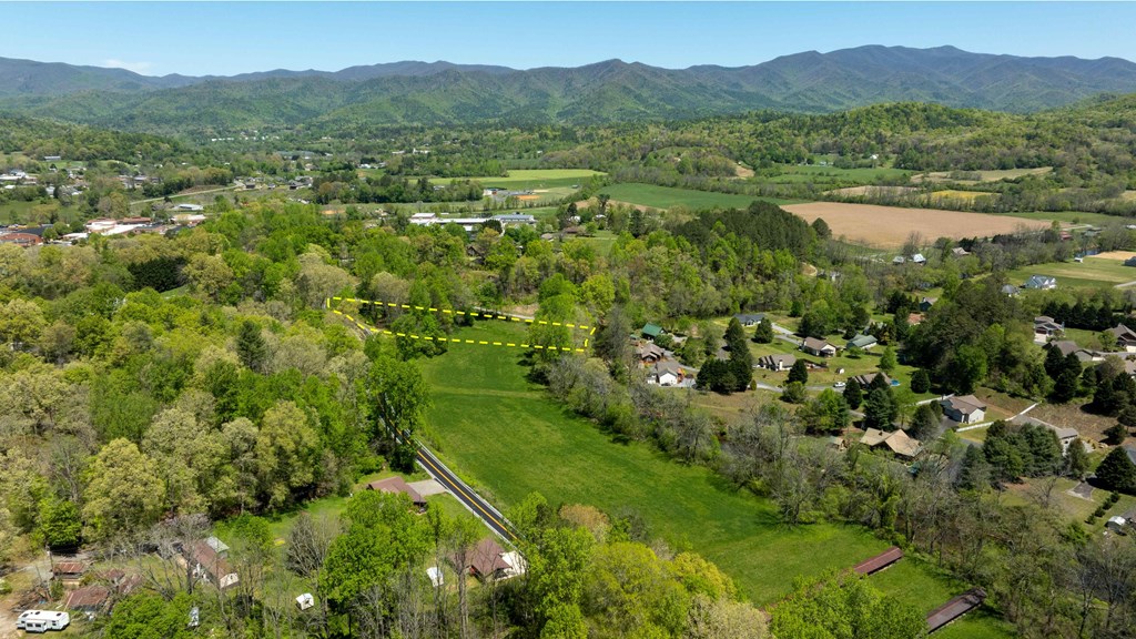 981 Myers Chapel Road Hayesville, NC 28904 - Photo 8 of 44 a view of a lush green hillside and houses