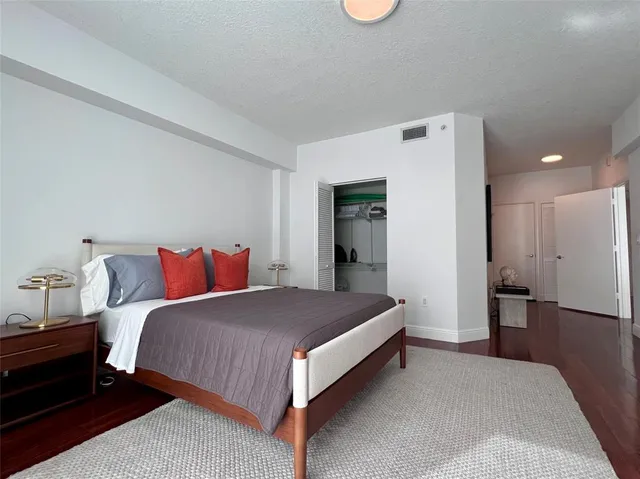 a view of a small space with wooden floor