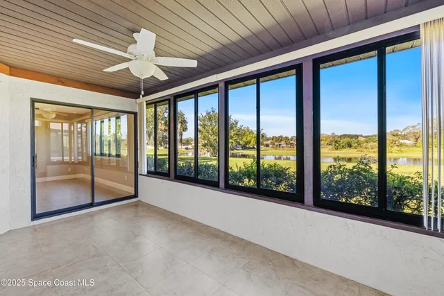 a view of an empty room with windows