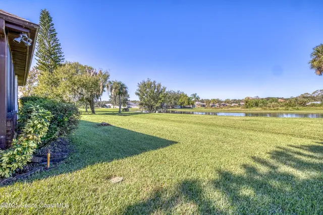 a view of a lake with a house in the background