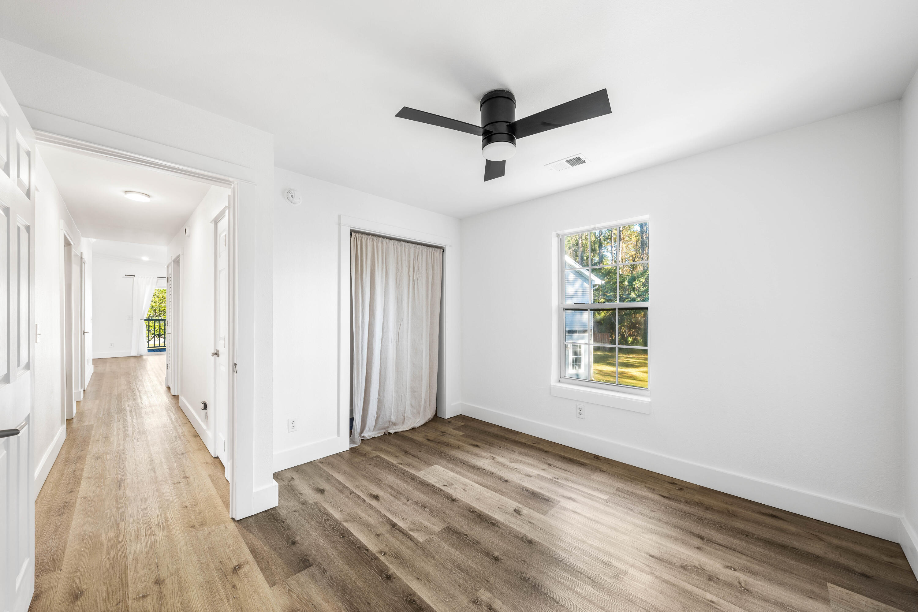 230 Plantation Way Santa Rosa Beach, FL 32459 - Photo 16 of 29 a view of a livingroom with a hard wood floor