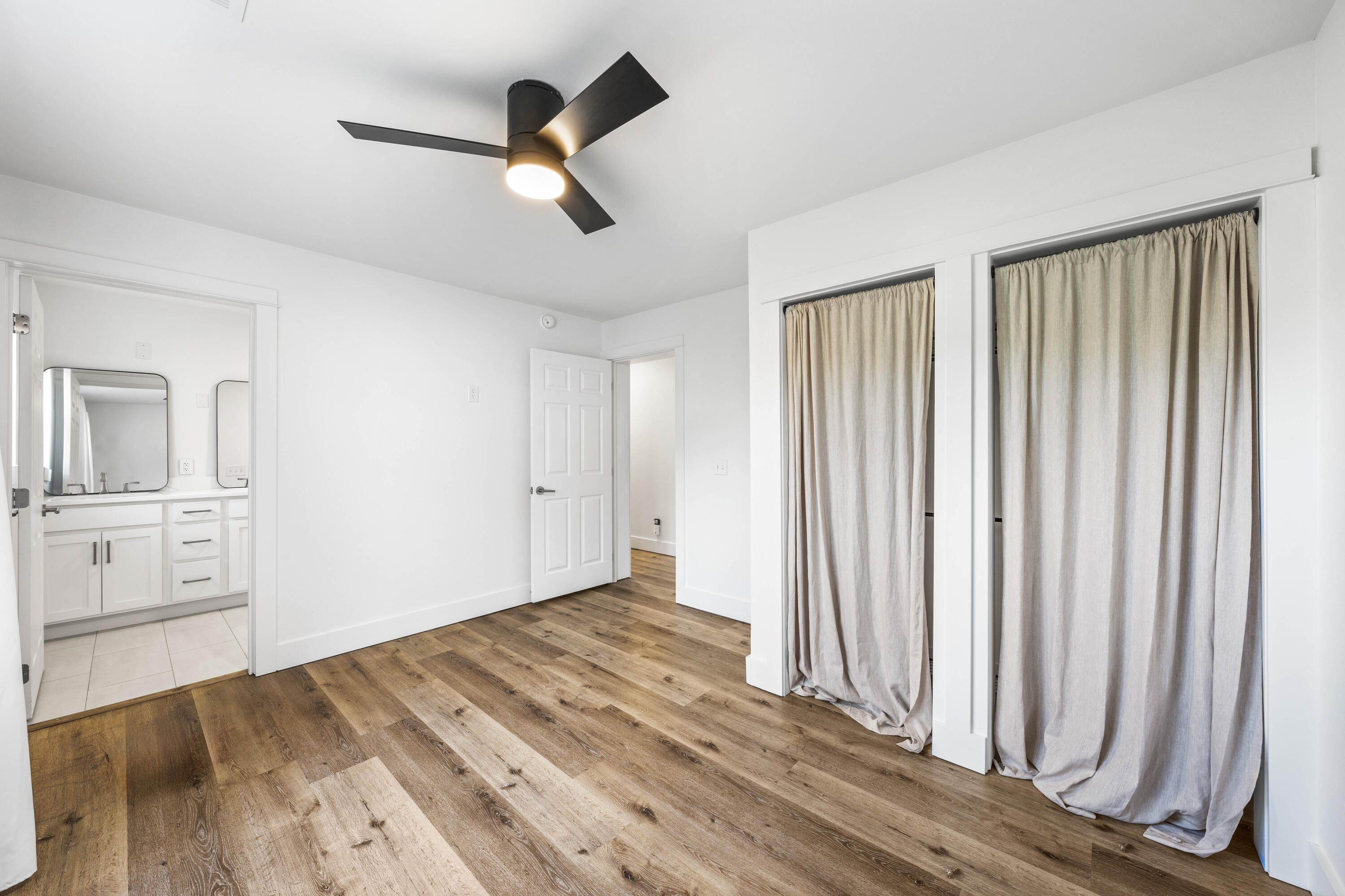 230 Plantation Way Santa Rosa Beach, FL 32459 - Photo 19 of 29 wooden floor in an empty room with a window