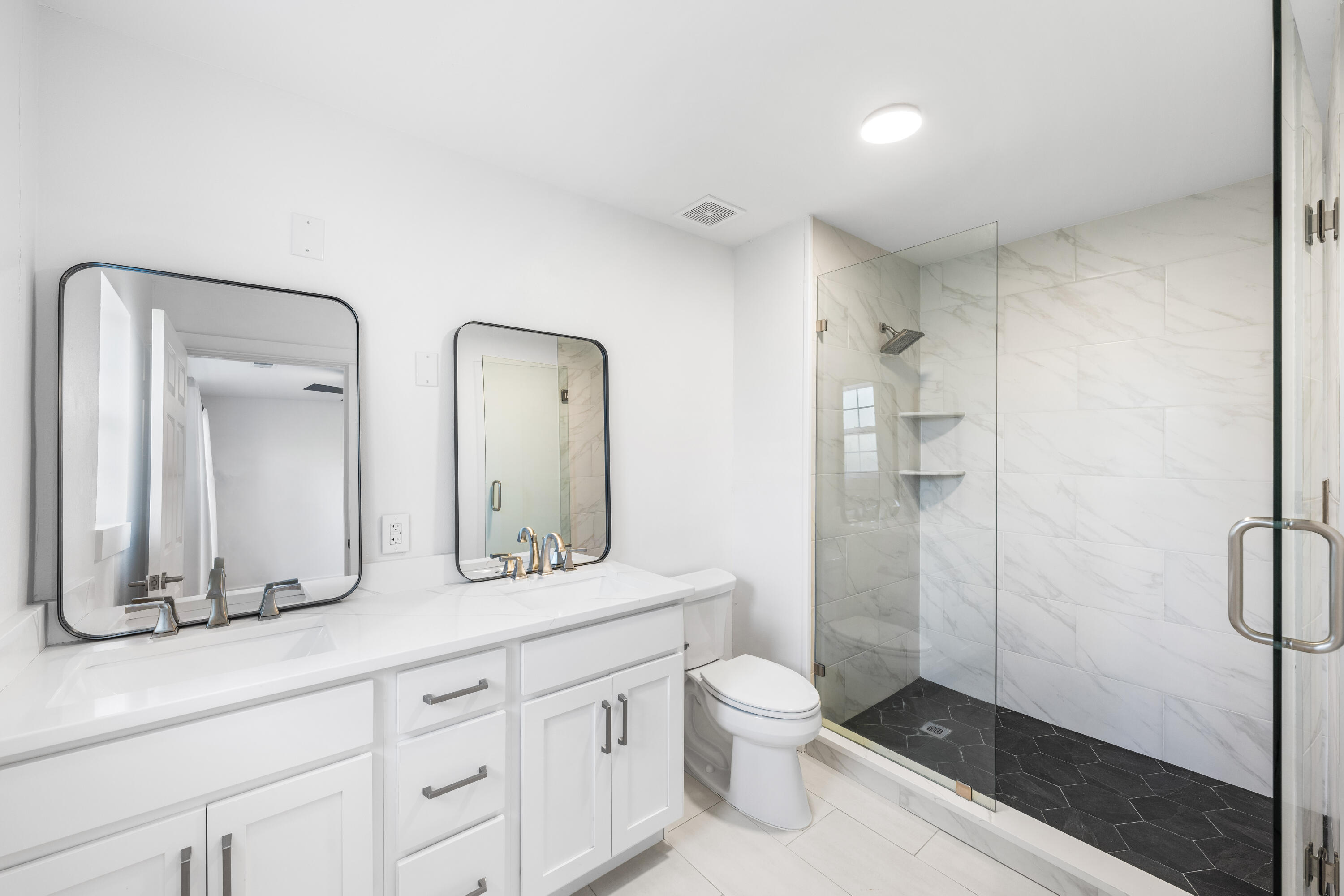 230 Plantation Way Santa Rosa Beach, FL 32459 - Photo 20 of 29 a bathroom with a double vanity sink mirror and toilet