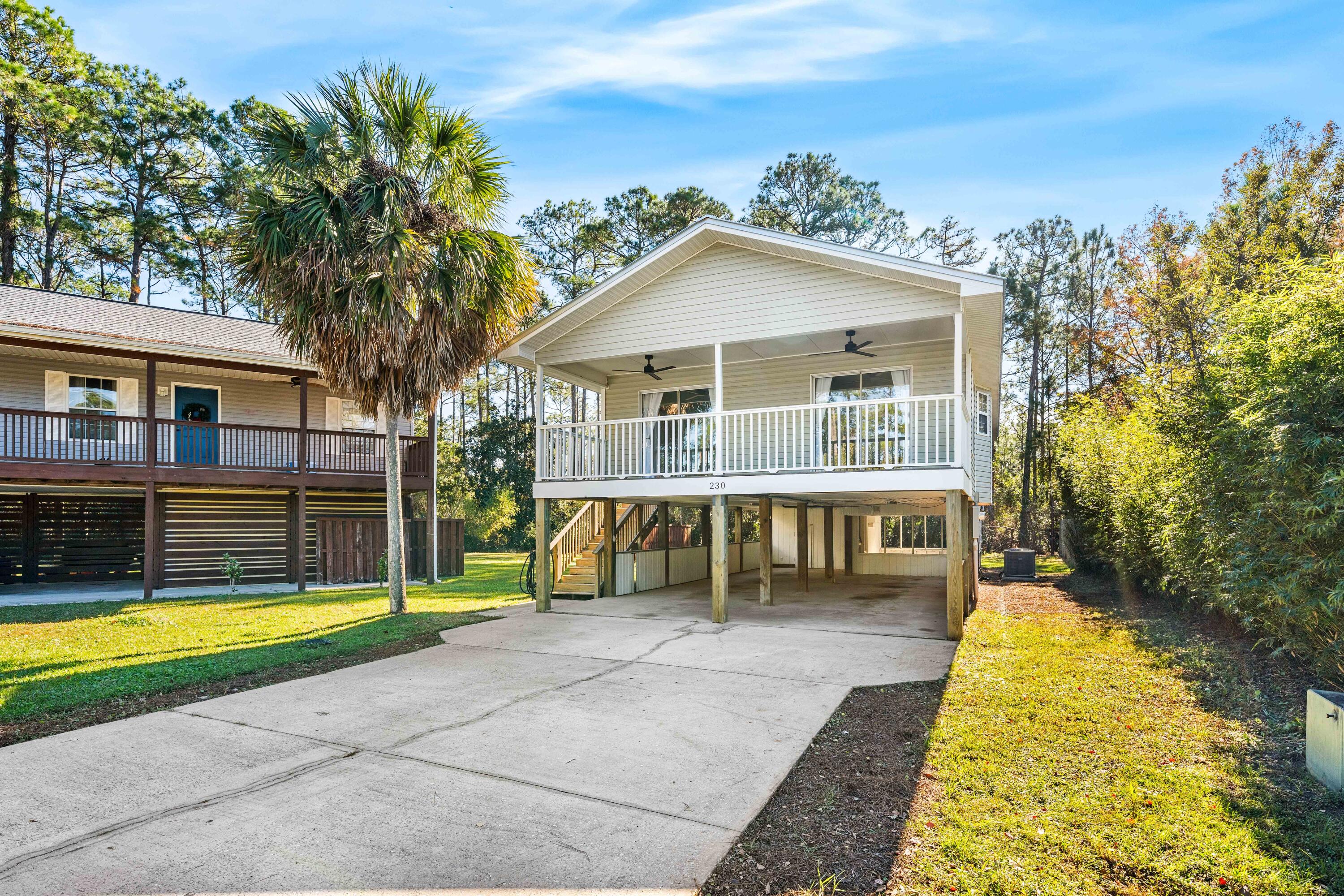 230 Plantation Way Santa Rosa Beach, FL 32459 - Photo 27 of 29 a view of a house with a swimming pool