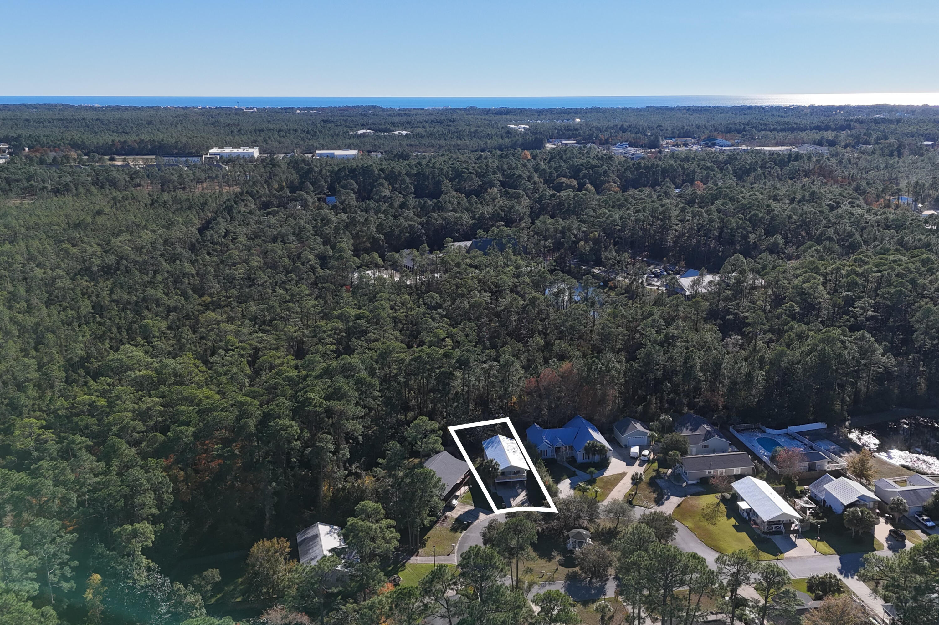 230 Plantation Way Santa Rosa Beach, FL 32459 - Photo 29 of 29 an aerial view of a house with a yard and mountain view