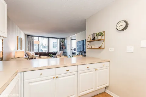 a kitchen with sink cabinets and a window