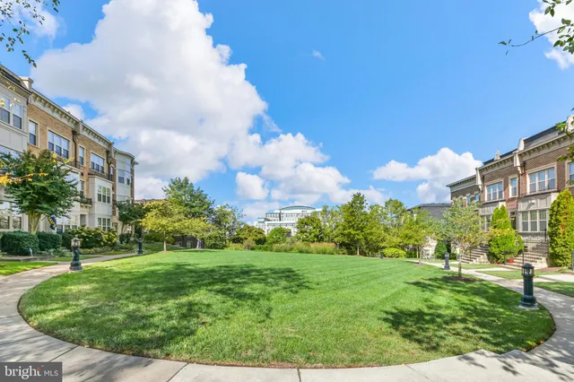 a living room with furniture a table and a chandelier
