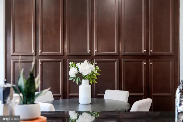 a bedroom with a bed and a mirror