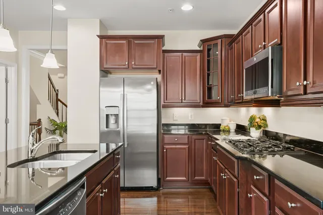 a bedroom with a large bed and a couch