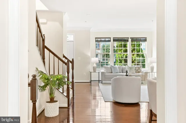 a bathroom with a granite countertop sink a large mirror and a bathtub with shower