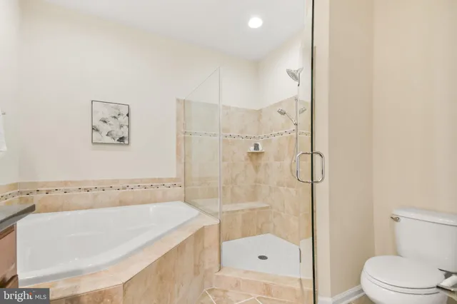 a bathroom with a toilet sink and a mirror