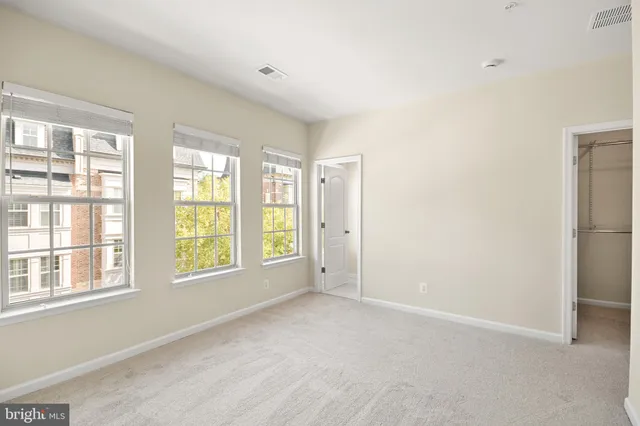 a view of a swimming pool with an outdoor seating and a lake view