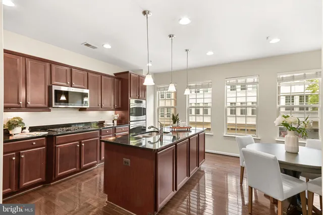 a spacious bedroom with a bed and a large window