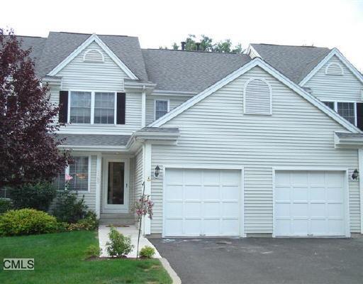 1705 Revere Road Danbury, CT 06811 - Photo 1 of 1 a front view of a house with a yard and garage