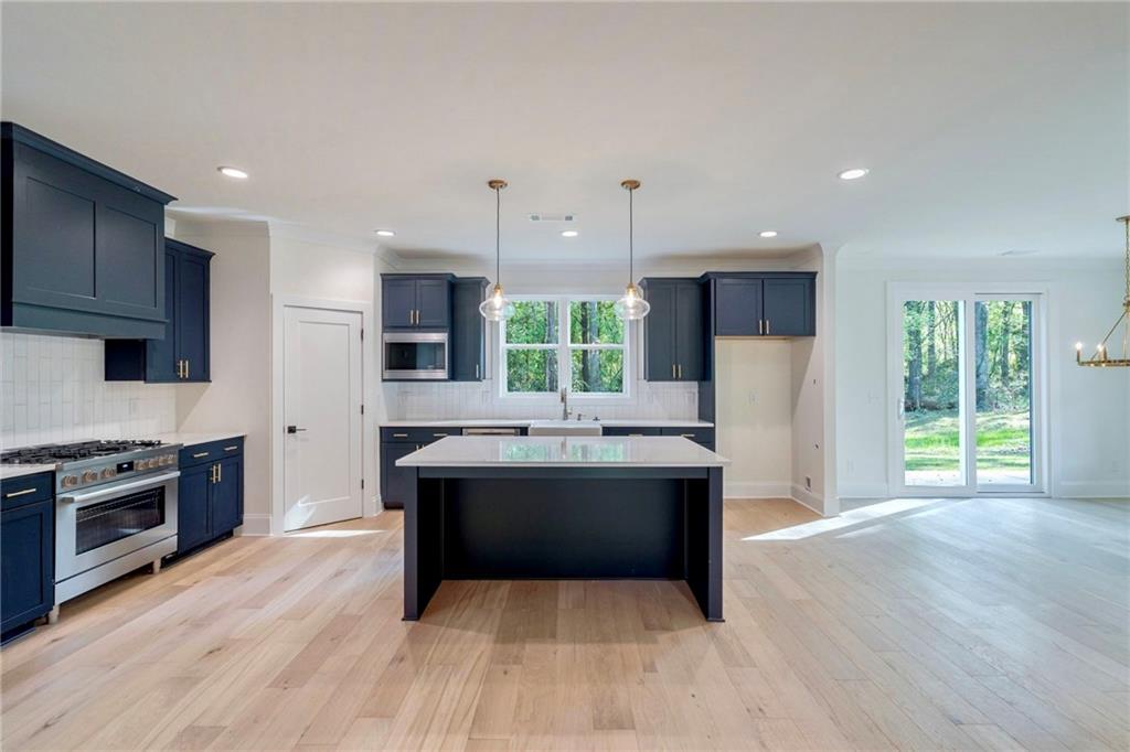 1709 Eastside Parc Street Atlanta, GA 30316 - Photo 14 of 38 a view of kitchen with stainless steel appliances granite countertop a stove and a refrigerator