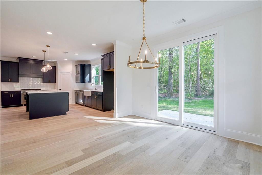 1709 Eastside Parc Street Atlanta, GA 30316 - Photo 19 of 38 a view of kitchen with stainless steel appliances wooden floor and window