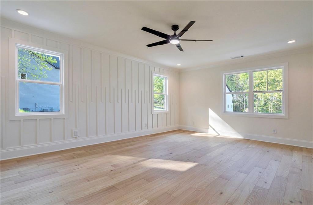 1709 Eastside Parc Street Atlanta, GA 30316 - Photo 24 of 38 a view of an empty room with a window and wooden floor