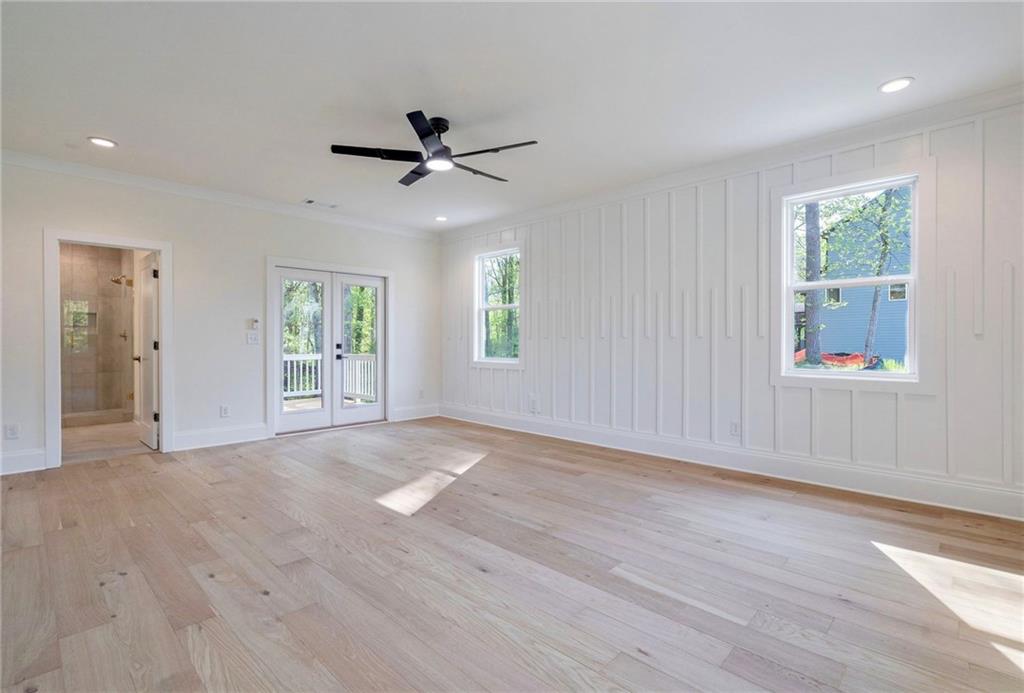 1709 Eastside Parc Street Atlanta, GA 30316 - Photo 26 of 38 a view of an empty room with a window and wooden floor
