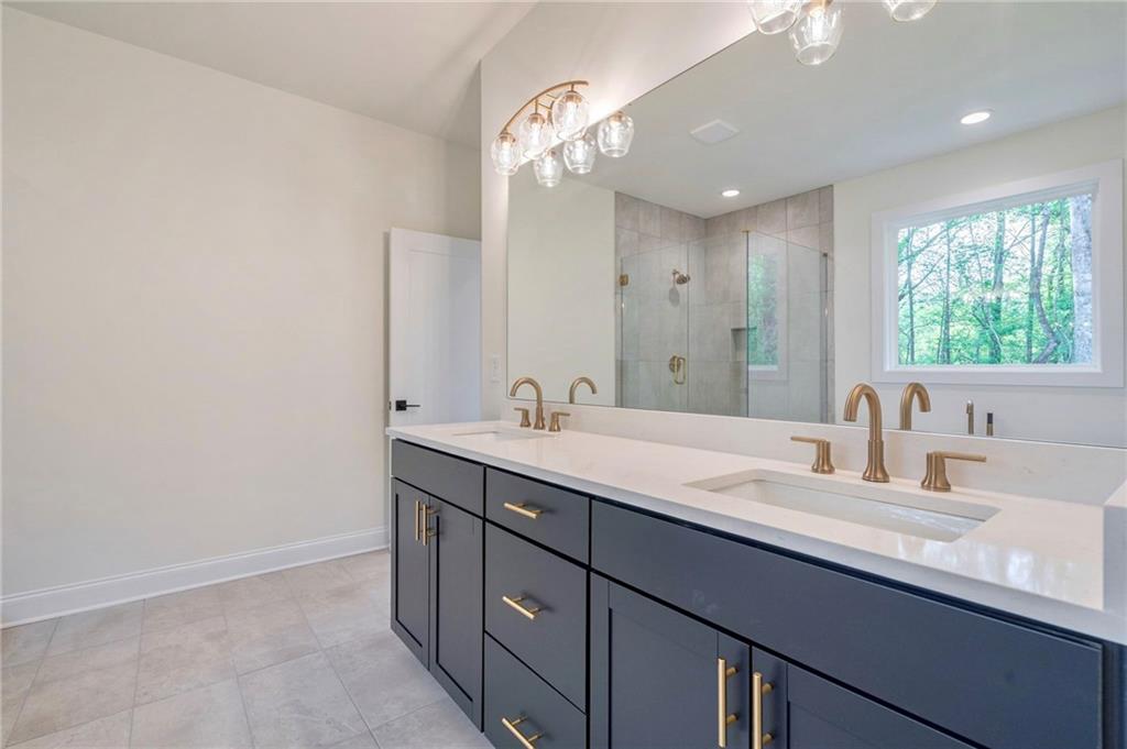 1709 Eastside Parc Street Atlanta, GA 30316 - Photo 27 of 38 a bathroom with a double vanity sink and a mirror