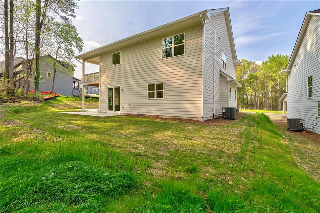 1709 Eastside Parc Street Atlanta, GA 30316 - Photo 36 of 38 a backyard of a house with table and chairs