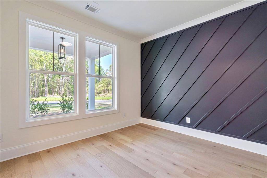 1709 Eastside Parc Street Atlanta, GA 30316 - Photo 6 of 38 a view of an empty room with wooden floor and a window