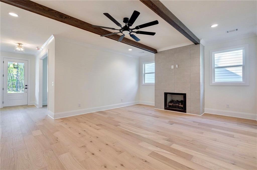 1709 Eastside Parc Street Atlanta, GA 30316 - Photo 8 of 38 an empty room with ceiling fan and windows