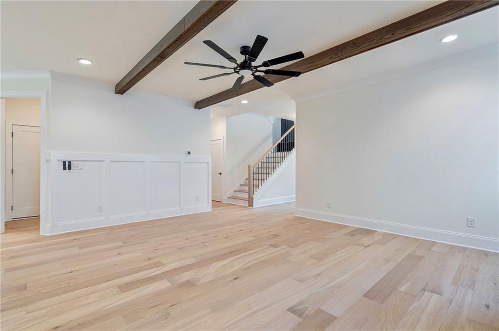 1709 Eastside Parc Street Atlanta, GA 30316 - Photo 10 of 38 a view of an empty room with wooden floor and a ceiling fan